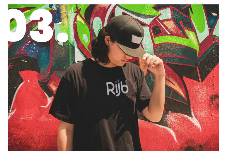 Rijb-image-a-man-is-wearing-a-cap-and-tshirt-with-rijb-logo-with-creative-background